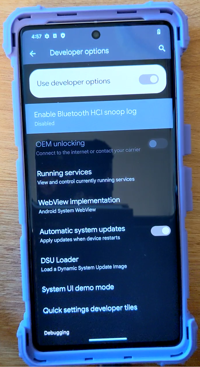 The Pixel 7 Pro Developer options settings screen, showing the OEM unlocking slider greyed out, with the label Connect to the internet or contact your carrier